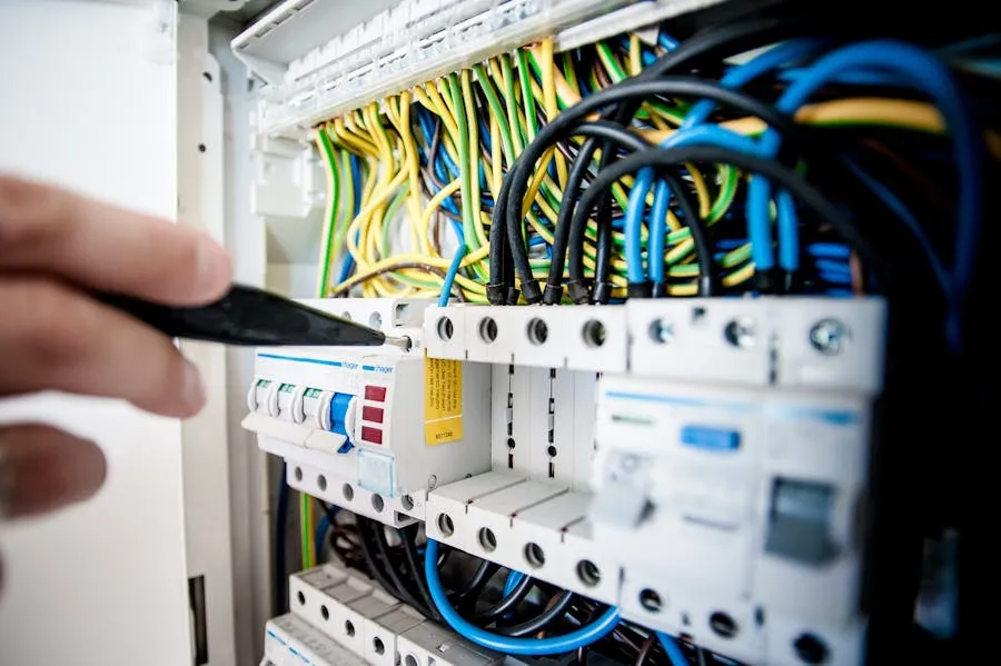 Electrician working in a switchboard