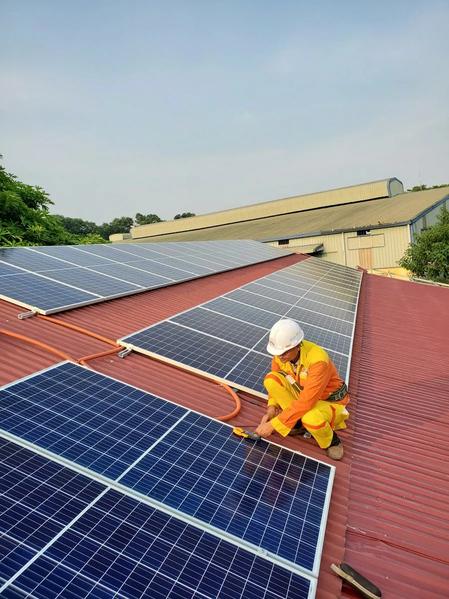 Solar technician fitting panels