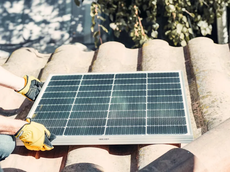 Hands placing a solar panel